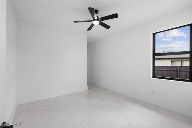 spare room featuring ceiling fan