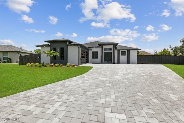 prairie-style home with a front yard