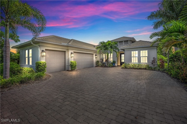 view of front of property with a garage