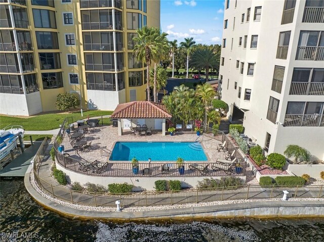 view of pool featuring a gazebo, a water view, and a patio