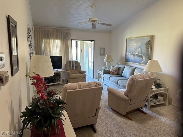 living room with carpet, vaulted ceiling, and a ceiling fan