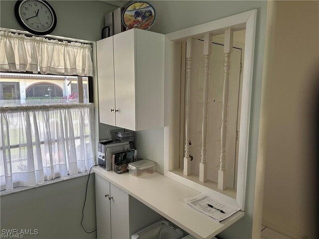 kitchen featuring light countertops and white cabinets