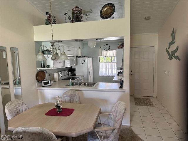 dining space featuring wood ceiling and light tile patterned floors