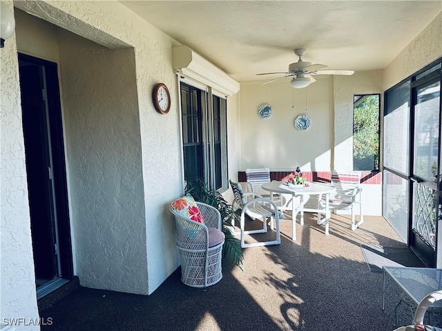 sunroom / solarium with ceiling fan