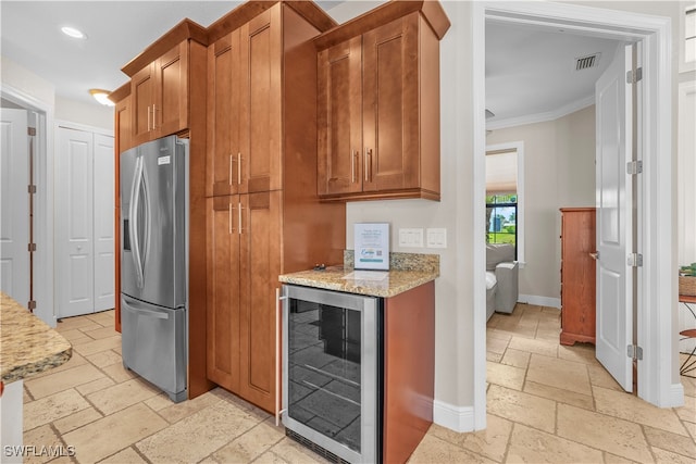 kitchen featuring ornamental molding, light stone counters, wine cooler, and stainless steel fridge with ice dispenser