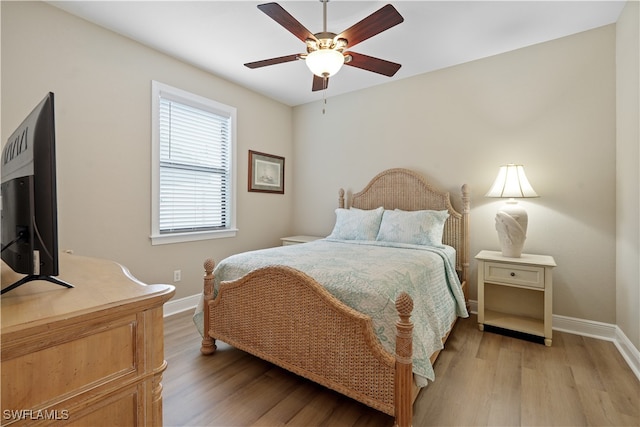 bedroom featuring ceiling fan and hardwood / wood-style flooring