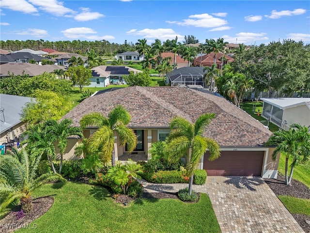 view of front of house with a garage and a front yard