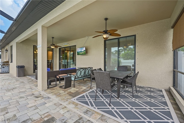 view of patio / terrace featuring a grill, outdoor lounge area, and ceiling fan