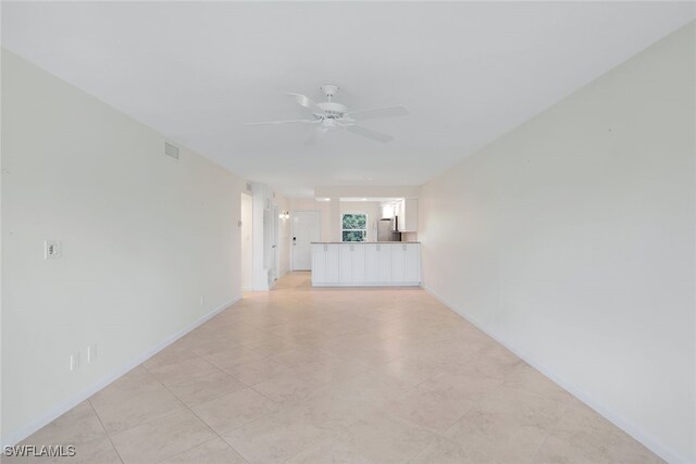 spare room with ceiling fan