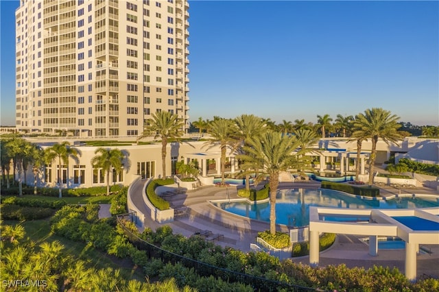 view of community featuring a swimming pool and a patio area