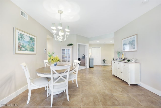 dining space with a chandelier