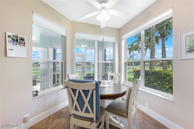 sunroom featuring ceiling fan