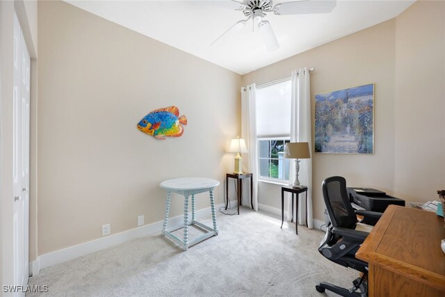 carpeted home office with ceiling fan