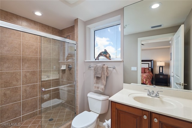 bathroom with vanity, toilet, and walk in shower