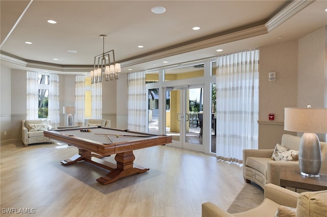 game room with french doors, light wood-type flooring, crown molding, and pool table