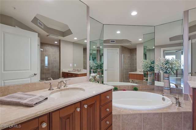 bathroom with vanity and plus walk in shower