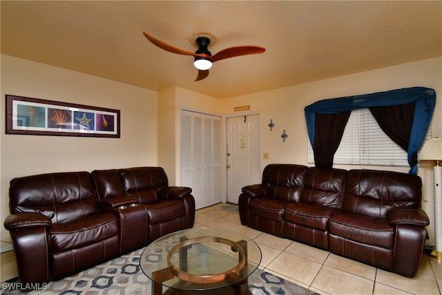 tiled living room featuring ceiling fan