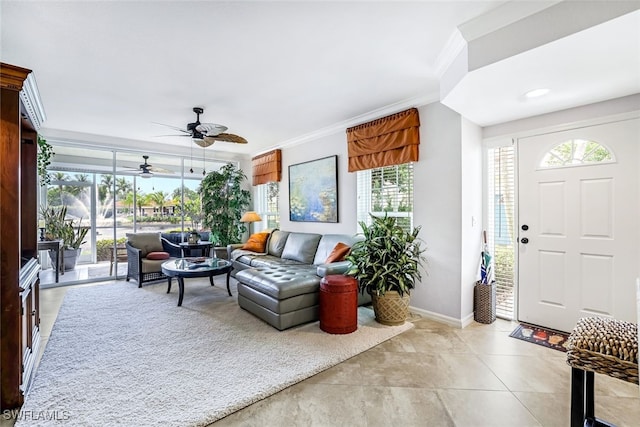 living room with crown molding and ceiling fan