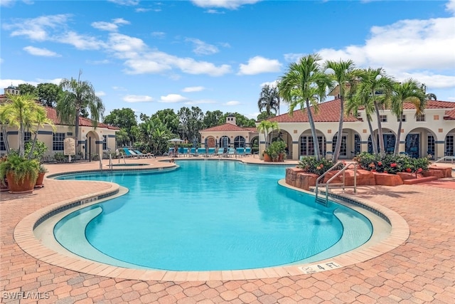 view of swimming pool with a patio