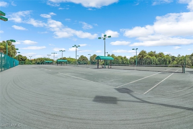 view of sport court with fence