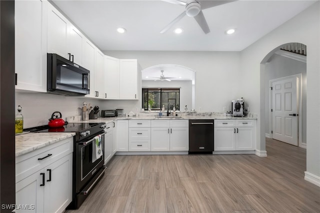 kitchen featuring ceiling fan, electric range, white cabinetry, and stainless steel dishwasher