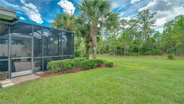 view of yard featuring glass enclosure