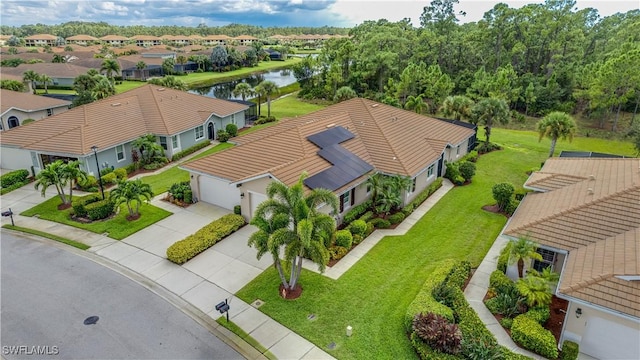 bird's eye view with a residential view and a water view