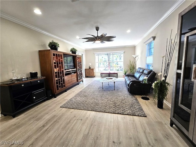 living area with crown molding, recessed lighting, a ceiling fan, and light wood-style floors