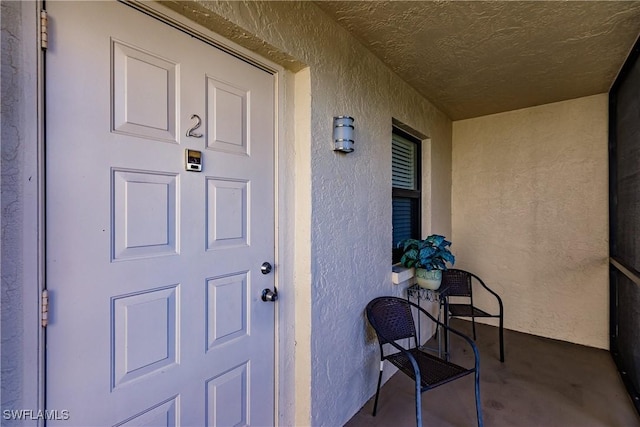 entrance to property with covered porch