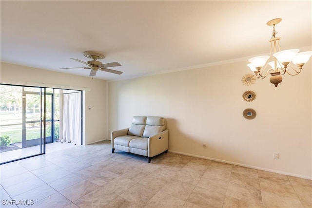 unfurnished room with ceiling fan with notable chandelier