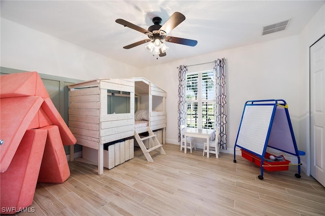 misc room featuring light hardwood / wood-style floors and ceiling fan