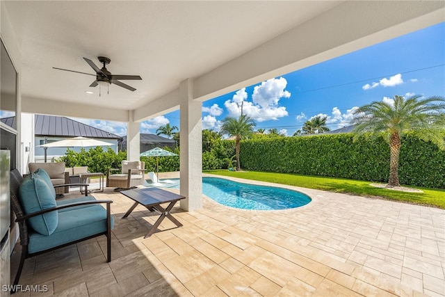 view of swimming pool with an outdoor hangout area, ceiling fan, and a patio area