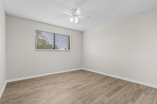 11653 Pointe Circle Dr, Fort Myers, FL 33908 - unfurnished room featuring light wood-style floors, a textured ceiling, and a ceiling fan