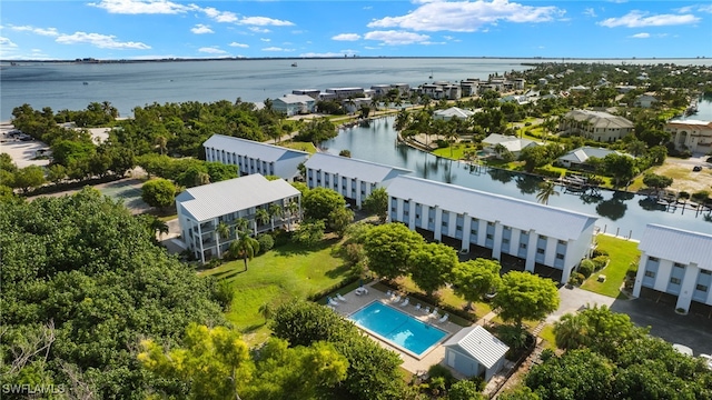 birds eye view of property with a water view