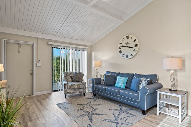 living room featuring light hardwood / wood-style flooring, wood ceiling, and vaulted ceiling with beams