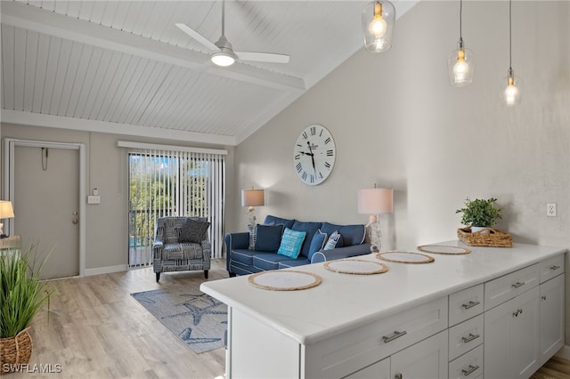 living room featuring vaulted ceiling with beams, light hardwood / wood-style floors, wooden ceiling, and ceiling fan