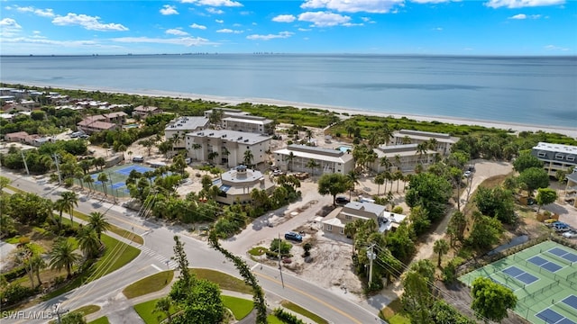 bird's eye view featuring a view of the beach and a water view