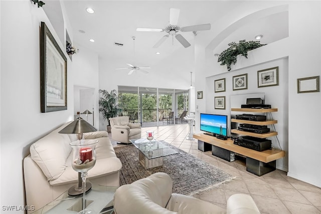 living room with light tile patterned flooring and a high ceiling