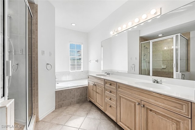 bathroom with tile patterned floors, vanity, and plus walk in shower