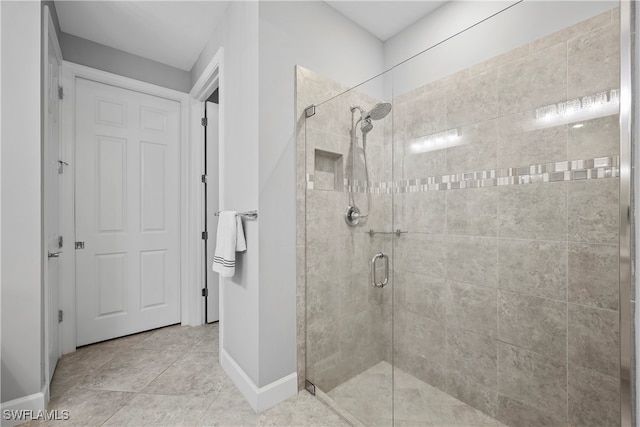 bathroom featuring a shower with door