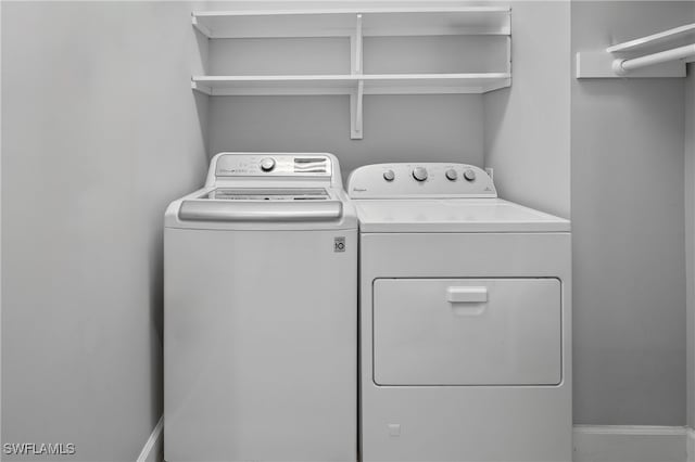 laundry area with washer and clothes dryer