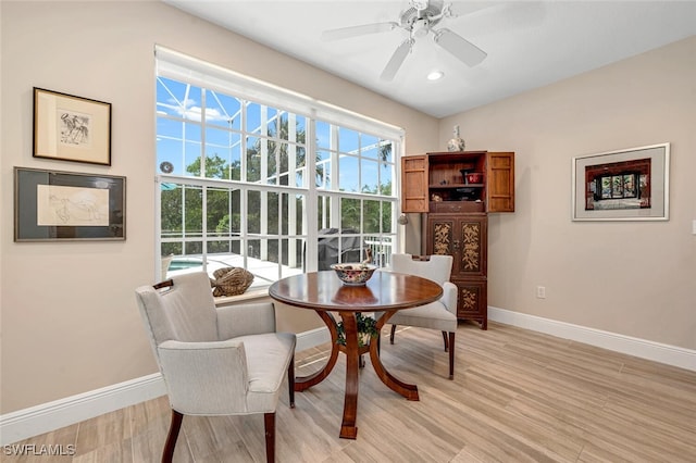 dining area featuring light hardwood / wood-style floors, ceiling fan, and a wealth of natural light