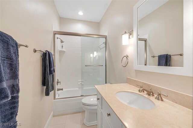 full bathroom with vanity, tile patterned flooring, enclosed tub / shower combo, and toilet