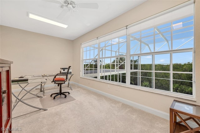 interior space featuring ceiling fan and carpet floors