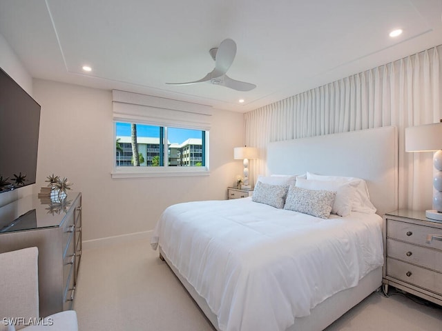 bedroom with light carpet and ceiling fan