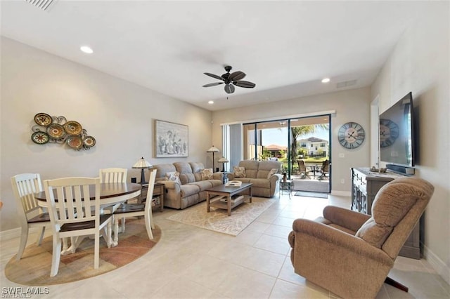 living room with ceiling fan and light tile patterned floors