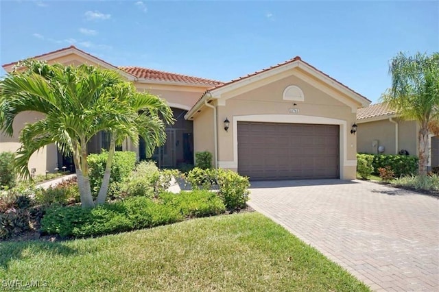 mediterranean / spanish house with a garage