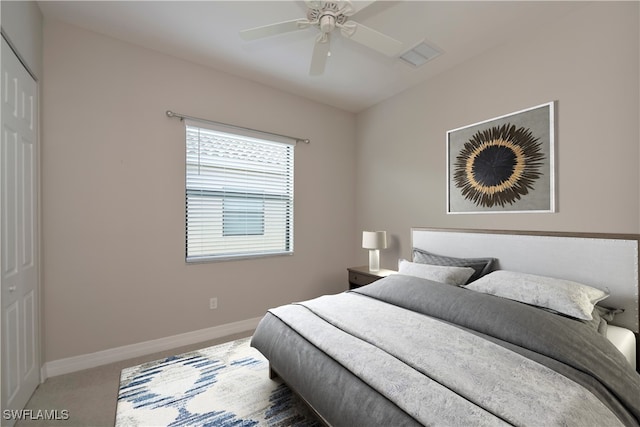 bedroom with carpet flooring, ceiling fan, and a closet