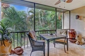 sunroom / solarium featuring ceiling fan