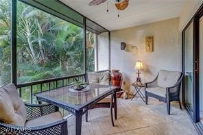 sunroom with a ceiling fan